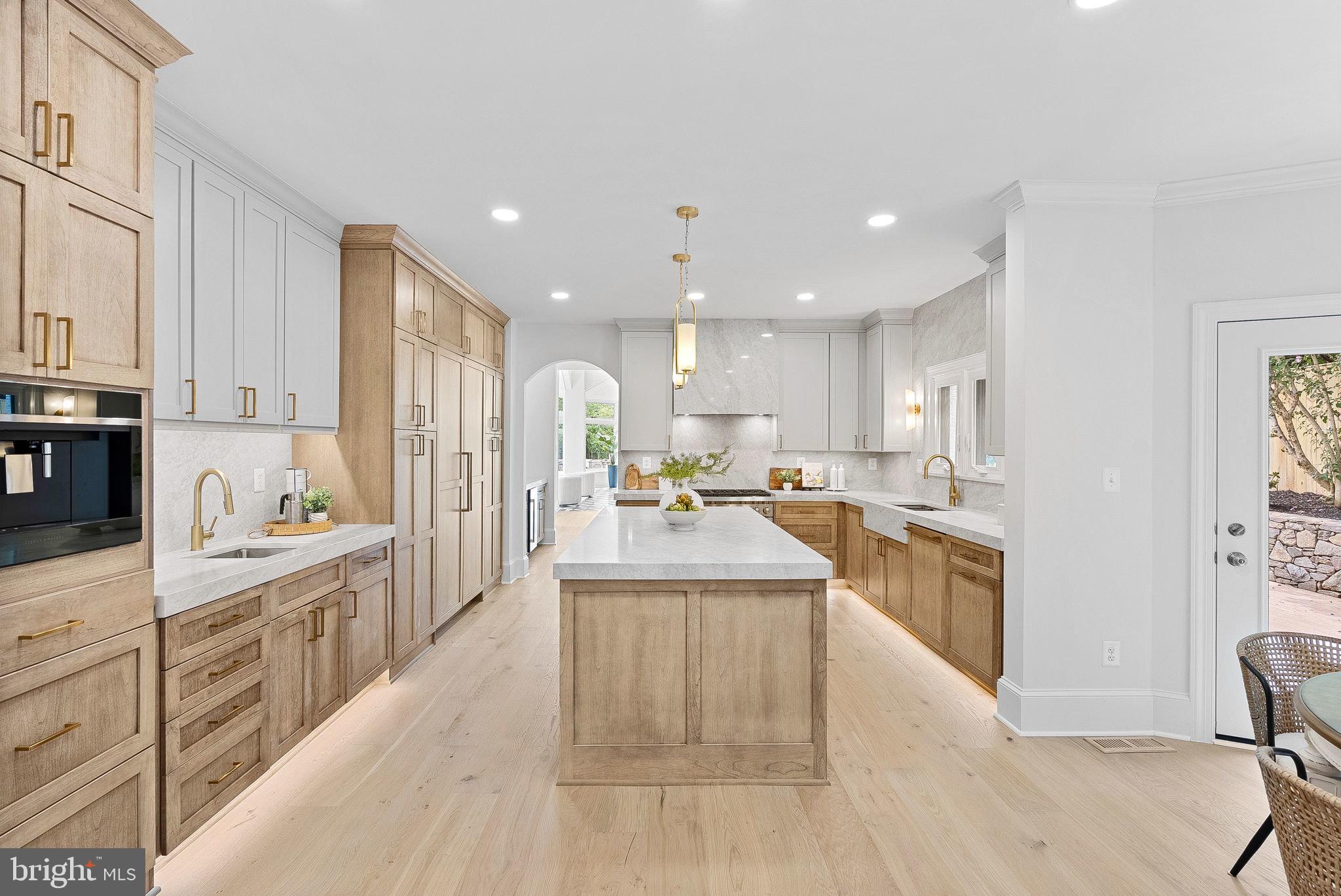 6121 Long Meadow Road McLean, VA 22101 - Photo 4 of 5 a kitchen with counter top space with sink stove and refrigerator