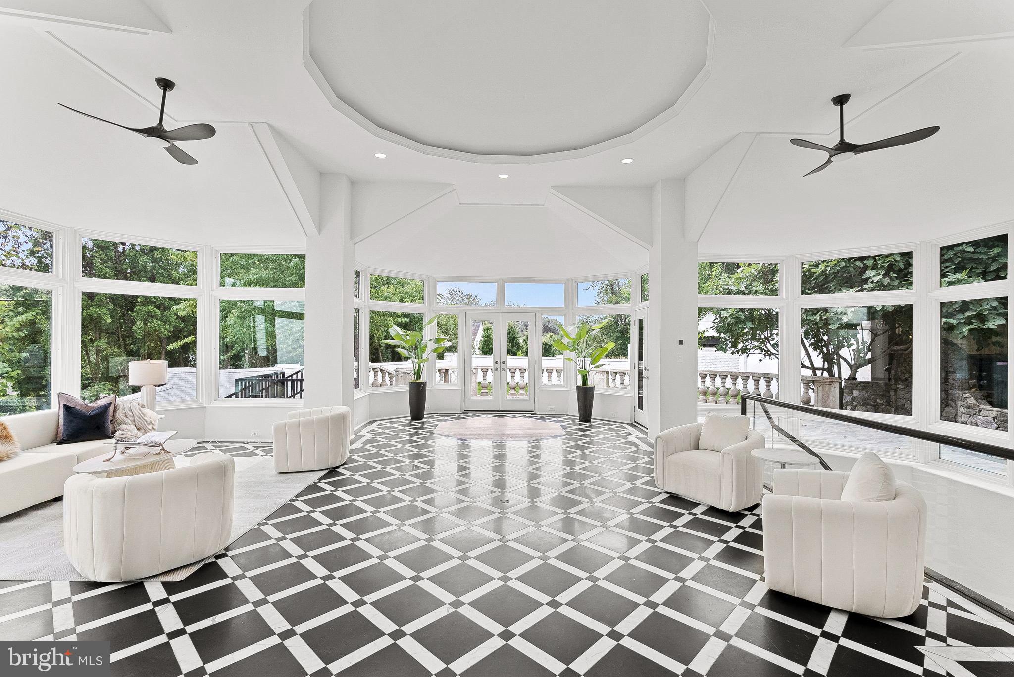 6121 Long Meadow Road McLean, VA 22101 - Photo 5 of 5 a living room with furniture a flat screen tv and a large window