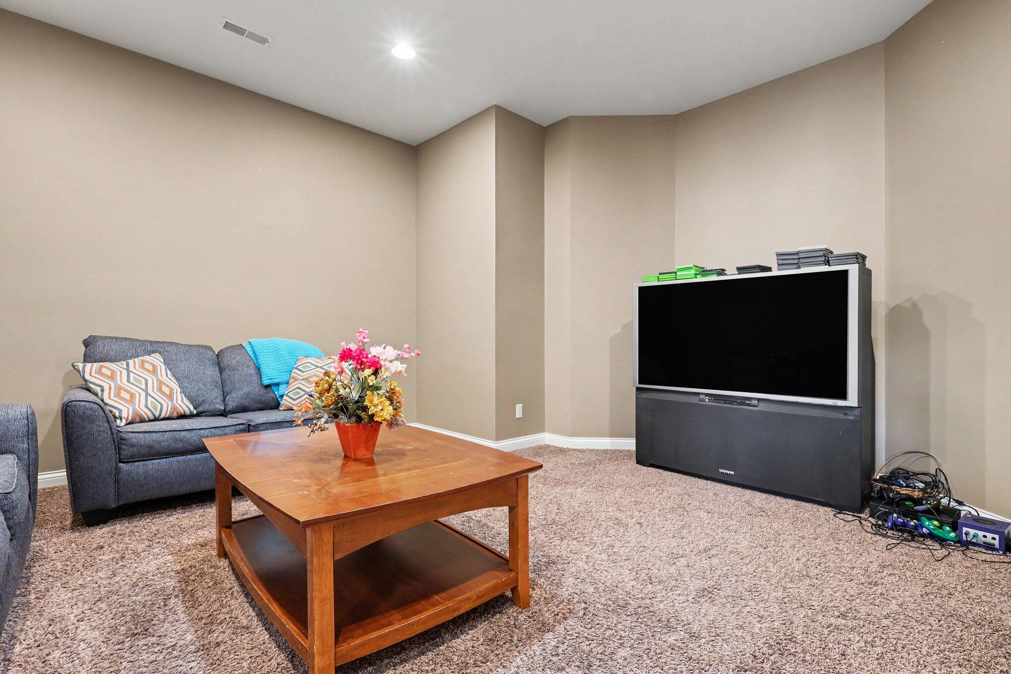 10195 Floyd Street Crown Point, IN 46307 - Photo 11 of 20 a living room with furniture and a flat screen tv