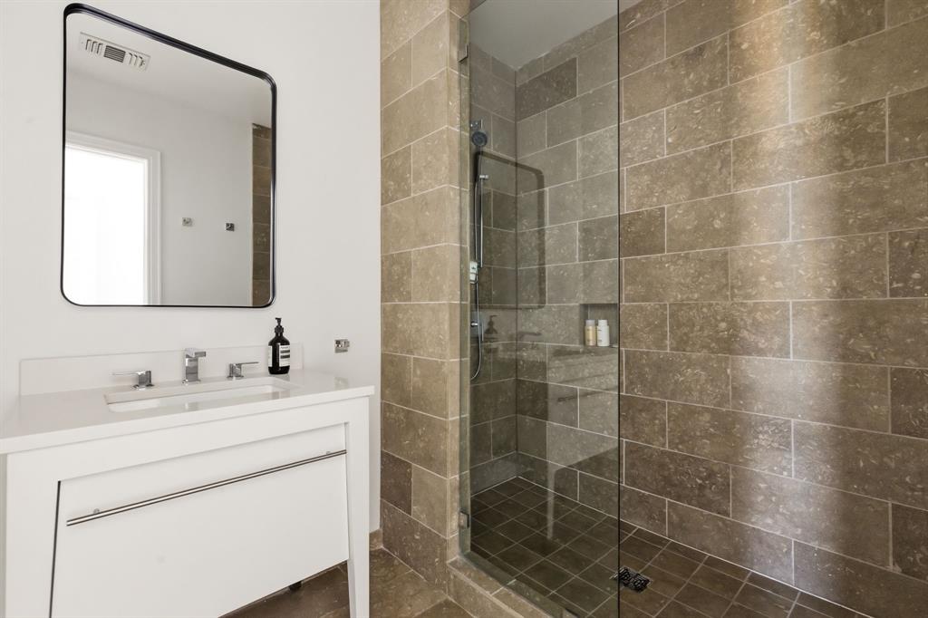 5656 North Central Expressway, Unit 801 Dallas, TX 75206 - Photo 11 of 26 a bathroom with a double vanity sink mirror and