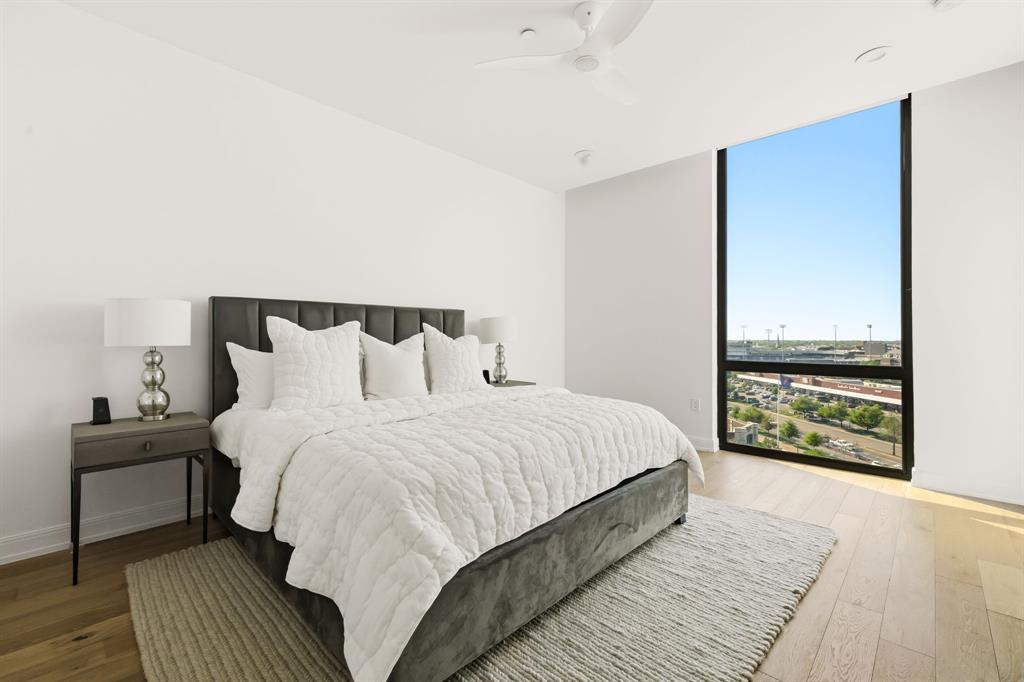 5656 North Central Expressway, Unit 801 Dallas, TX 75206 - Photo 13 of 26 a bedroom with a bed and large window
