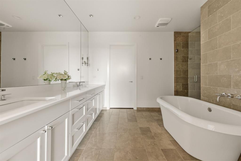 5656 North Central Expressway, Unit 801 Dallas, TX 75206 - Photo 16 of 26 a spacious bathroom with a tub sink and mirror