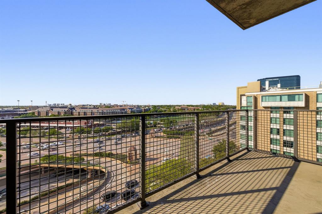 5656 North Central Expressway, Unit 801 Dallas, TX 75206 - Photo 17 of 26 a view of a balcony with wooden floor and fence