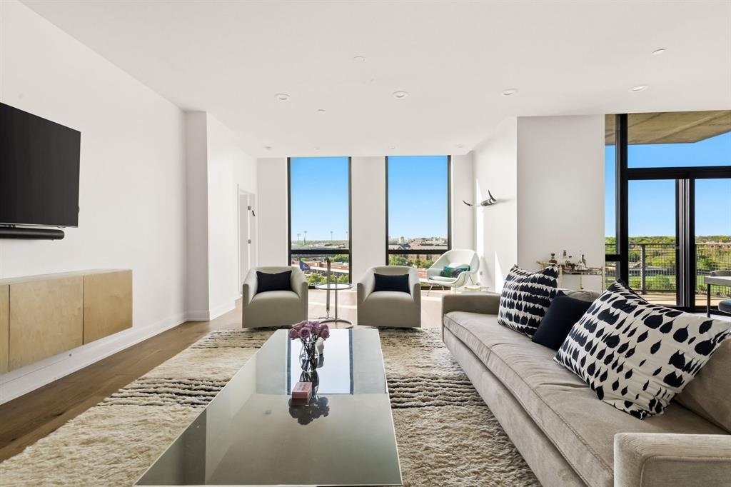 5656 North Central Expressway, Unit 801 Dallas, TX 75206 - Photo 2 of 26 a living room with furniture and a flat screen tv