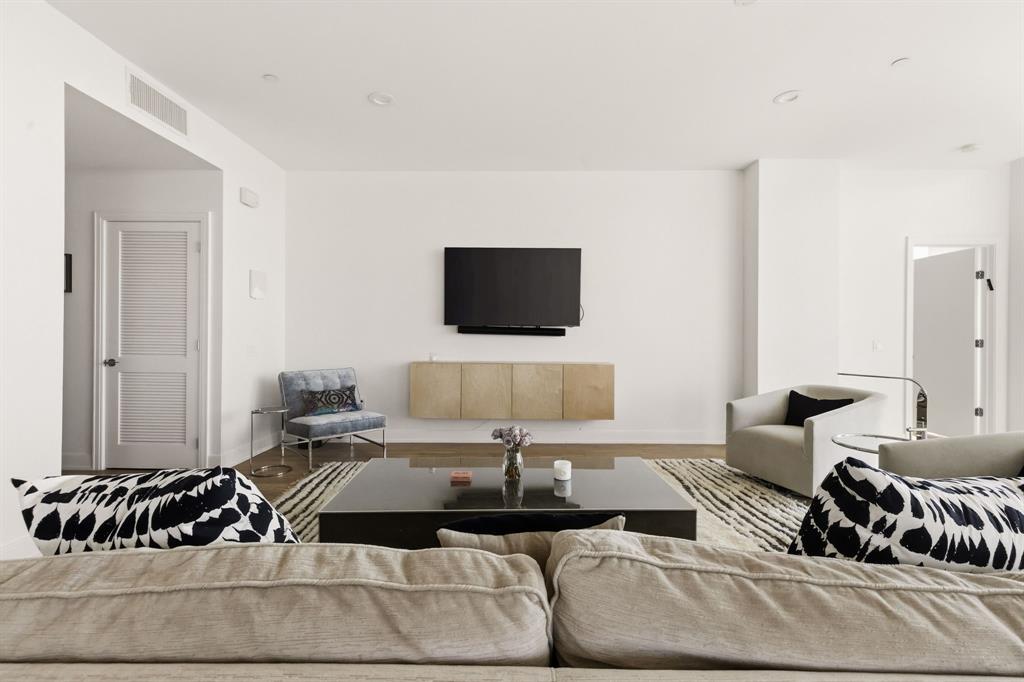5656 North Central Expressway, Unit 801 Dallas, TX 75206 - Photo 3 of 26 a living room with furniture and a flat screen tv