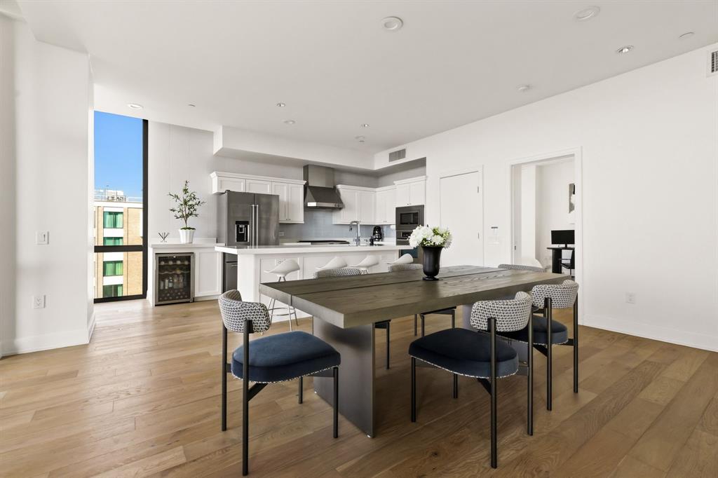 5656 North Central Expressway, Unit 801 Dallas, TX 75206 - Photo 4 of 26 a view of a dining room with furniture and wooden floor