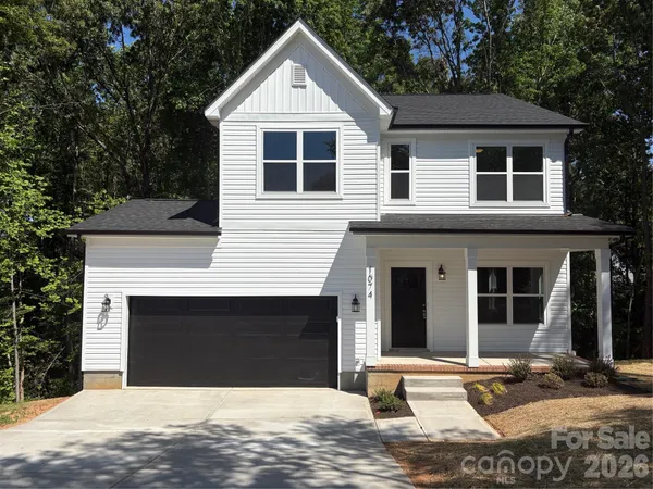 a front view of a house with yard
