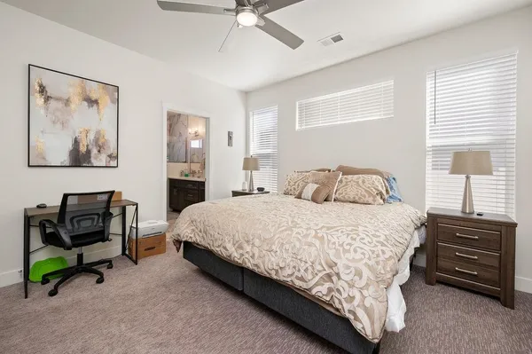 a bathroom with a double vanity sink mirror and shower