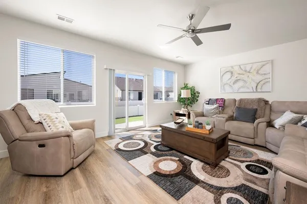 a living room with furniture and a large window