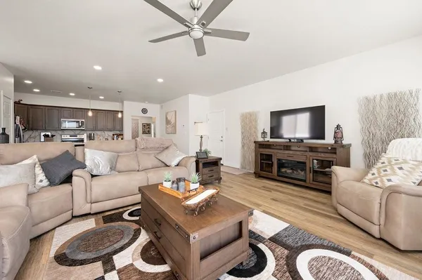 a kitchen with kitchen island a appliances dining table and chairs
