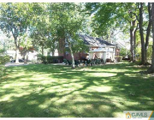15 Morningside Road Colonia, NJ 07067 - Photo 3 of 8 a view of a house with a big yard