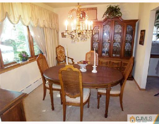 15 Morningside Road Colonia, NJ 07067 - Photo 5 of 8 a view of a dining room with furniture and window