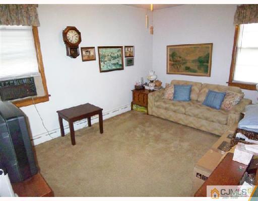 15 Morningside Road Colonia, NJ 07067 - Photo 8 of 8 a living room with furniture and a window