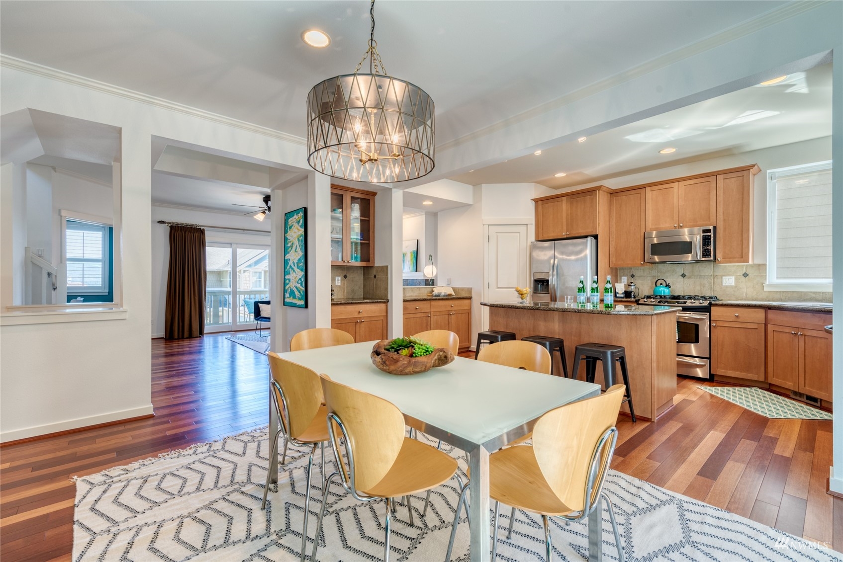569 Alpine Ridge Place Northwest Issaquah, WA 98027 - Photo 11 of 35 a view of a dining room with furniture wooden floor and chandelier