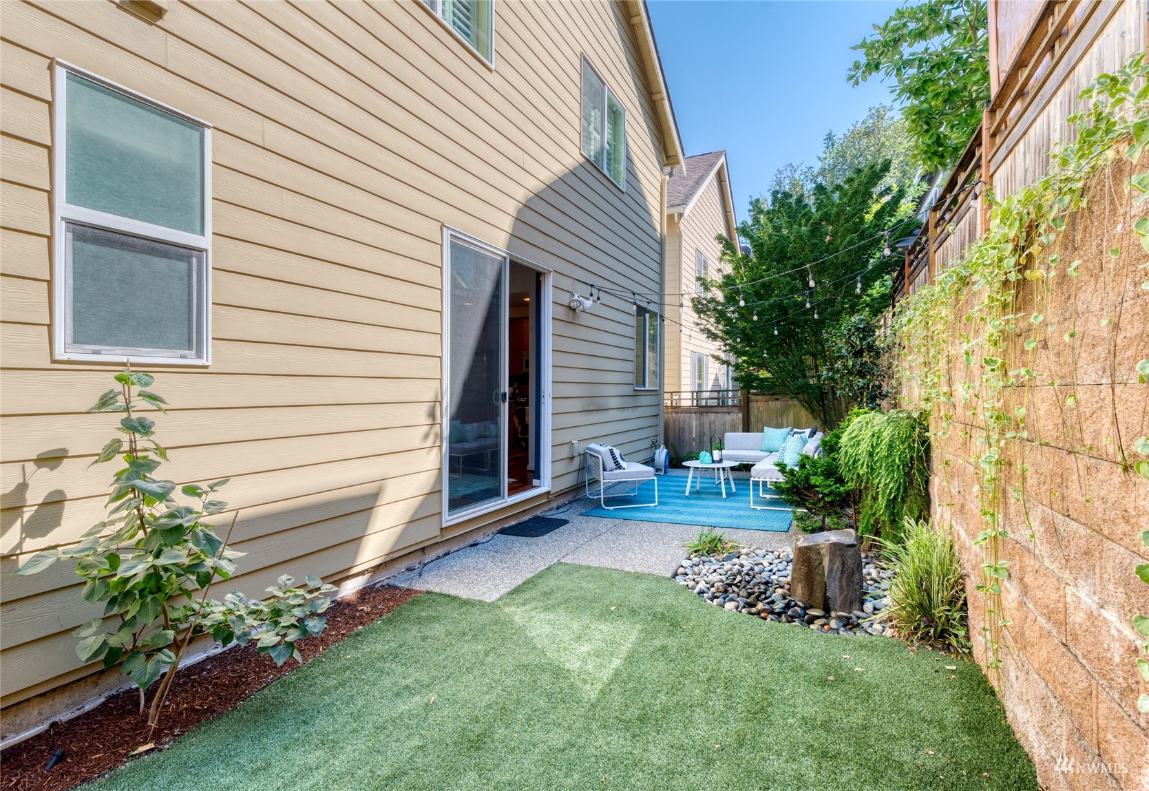 569 Alpine Ridge Place Northwest Issaquah, WA 98027 - Photo 27 of 35 a view of a house with a yard and sitting area
