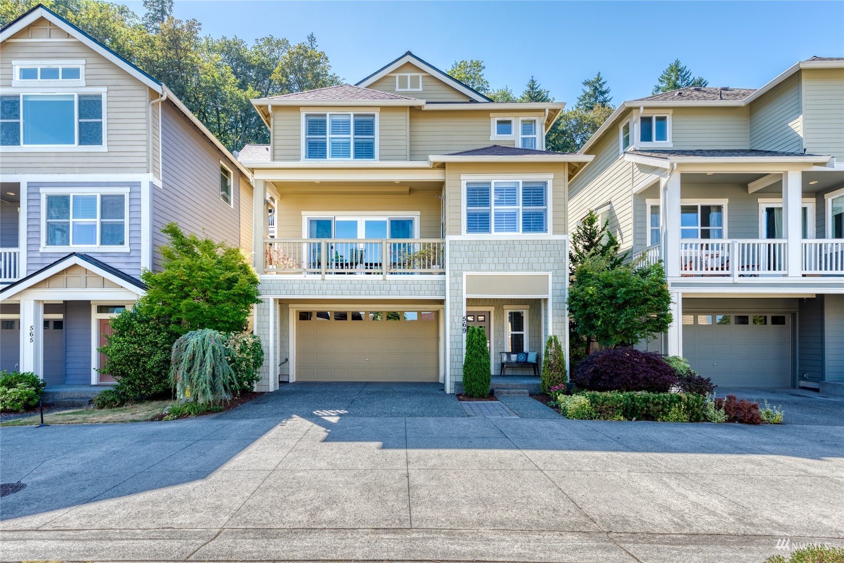 569 Alpine Ridge Place Northwest Issaquah, WA 98027 - Photo 32 of 35 a front view of a house with a yard and garage