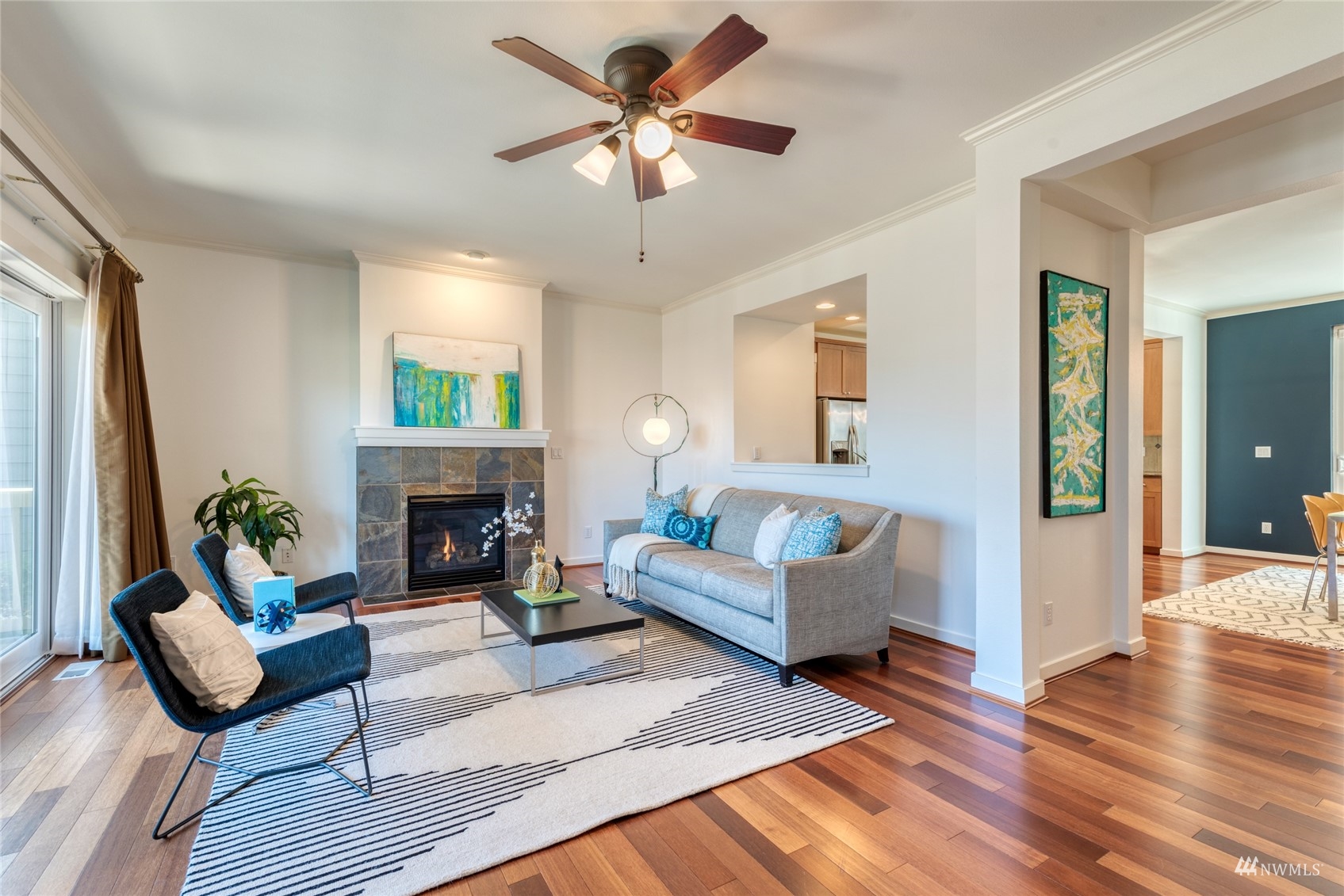 569 Alpine Ridge Place Northwest Issaquah, WA 98027 - Photo 4 of 35 a living room with furniture and a fireplace