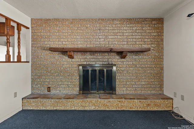 a living room with a fireplace