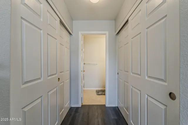 a bedroom with a bed chair and a window