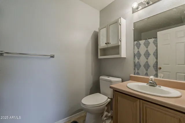 a view of a hallway with a hardwood