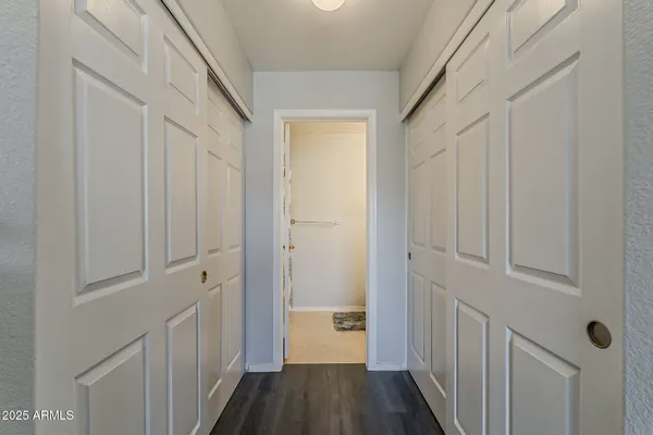 a bedroom with a bed chair and a window