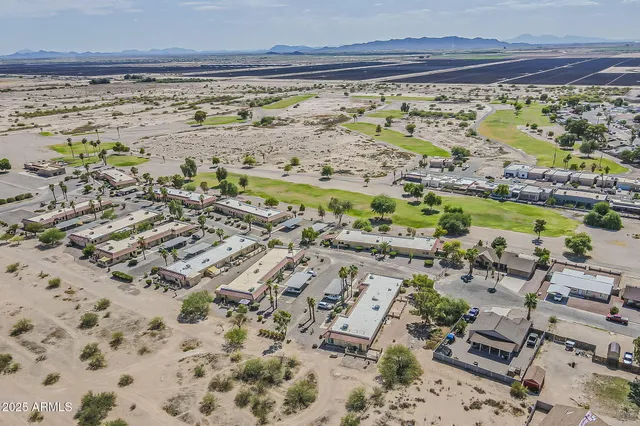 a view of a house with couches in front of house