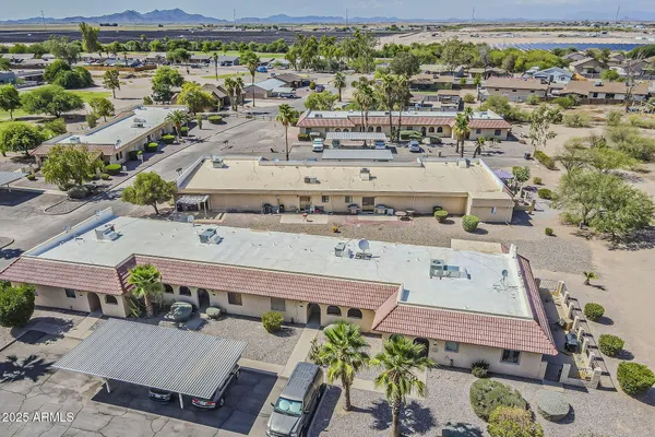 an aerial view of a house with a lot of trees