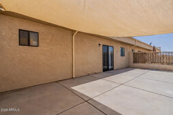 a kitchen with a sink stove top oven and refrigerator
