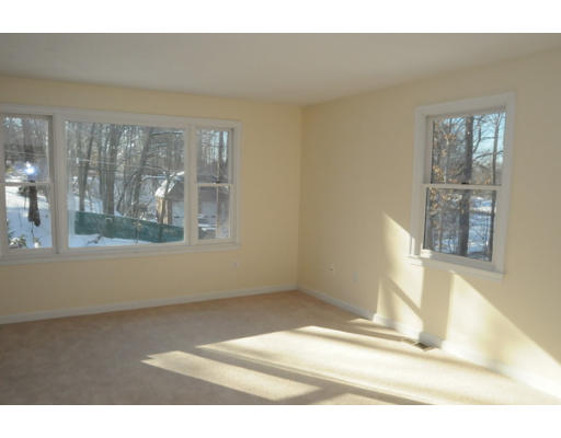 65 Sycamore Road Wayland, MA 01778 - Photo 4 of 20 a view of empty room with wooden floor and fan