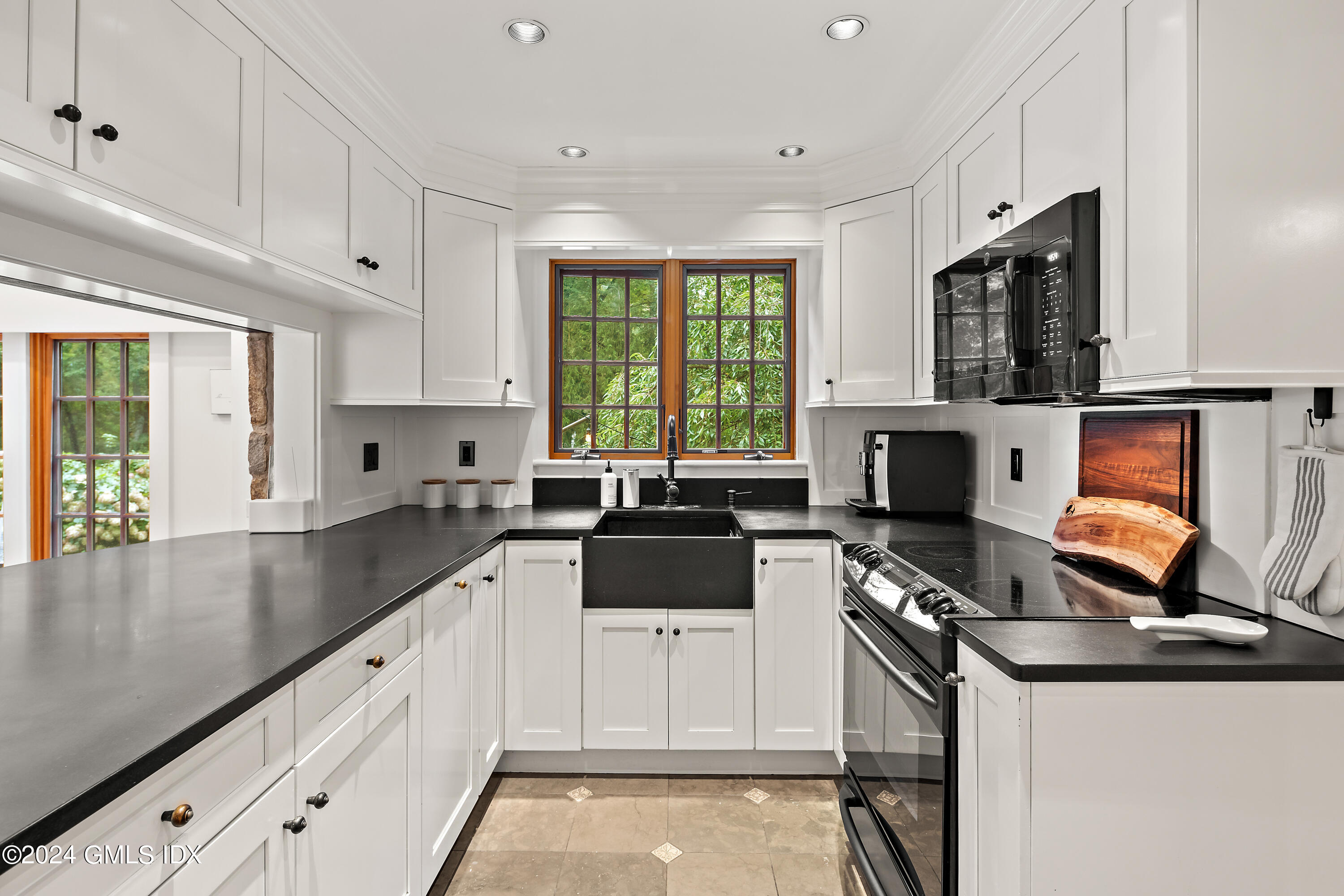 9 Webbs Hill Road Stamford, CT 06903 - Photo 8 of 38 a kitchen with stainless steel appliances a stove a sink and a microwave