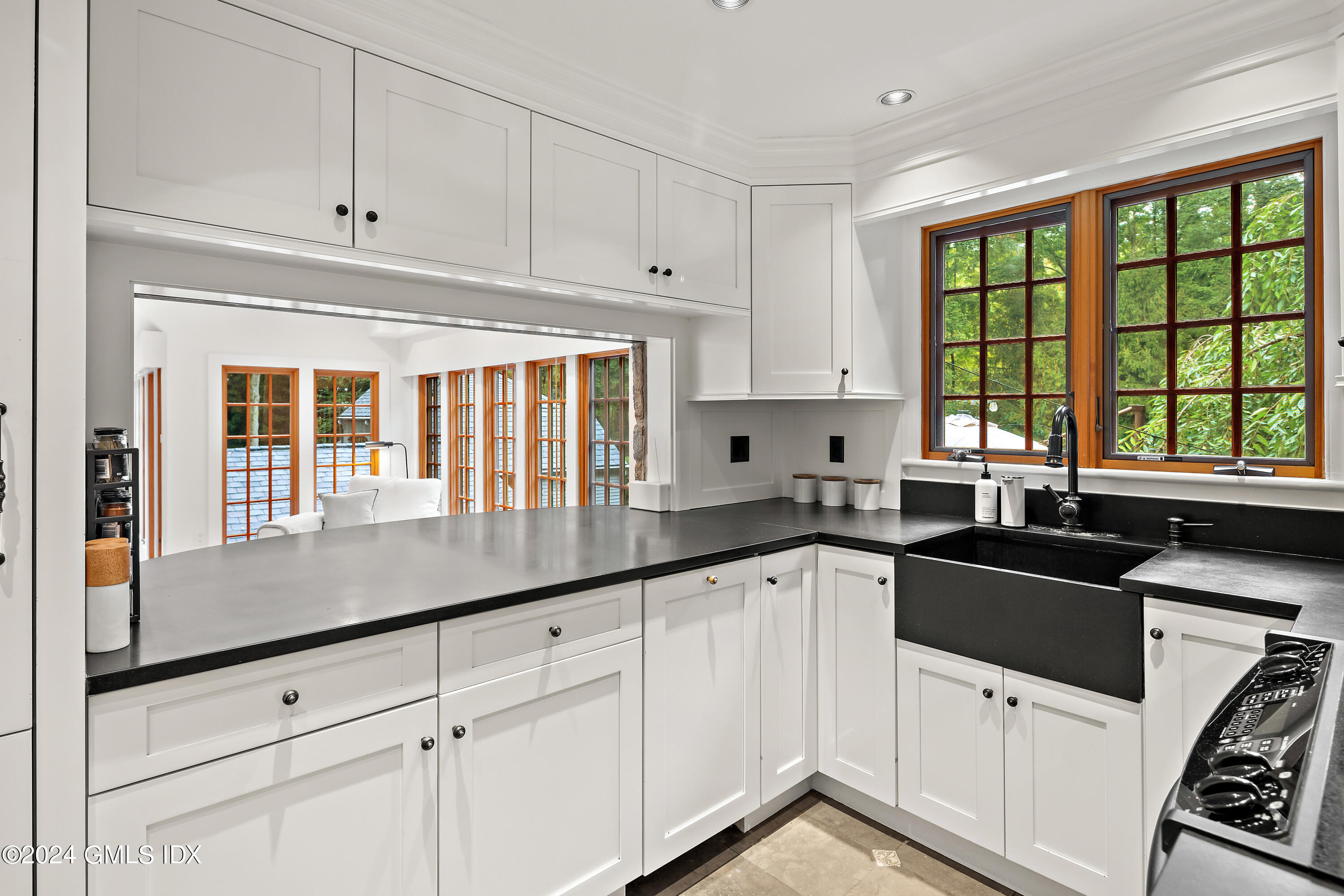 9 Webbs Hill Road Stamford, CT 06903 - Photo 9 of 38 a kitchen with granite countertop white cabinets and white appliances