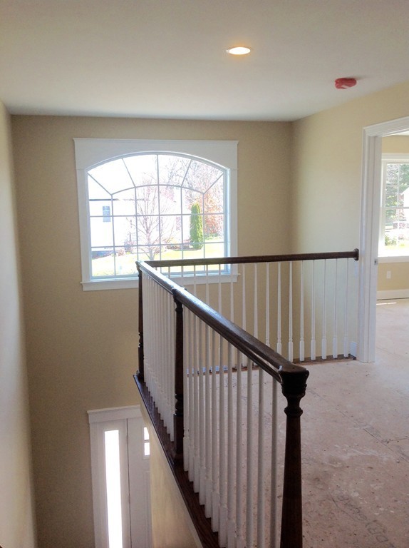 160 Edgell Road Framingham, MA 01701 - Photo 7 of 10 a view of staircase with wooden floor and a window