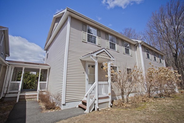 408 Bridge Road, Unit B Northampton, MA 01062 - Photo 1 of 22 a front view of a house with a porch