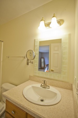 408 Bridge Road, Unit B Northampton, MA 01062 - Photo 16 of 22 a bathroom with a sink and a mirror