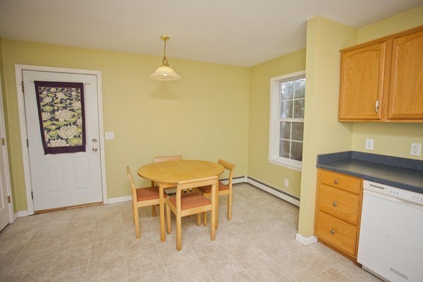 408 Bridge Road, Unit B Northampton, MA 01062 - Photo 3 of 22 a kitchen that has a table and chairs in it