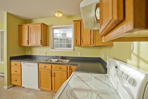 408 Bridge Road, Unit B Northampton, MA 01062 - Photo 7 of 22 a kitchen with a sink and cabinets