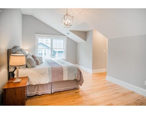 25 Lawton Road Needham, MA 02492 - Photo 19 of 34 a spacious bedroom with a bed and window