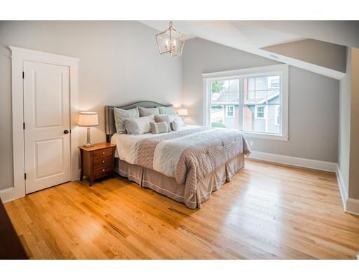 25 Lawton Road Needham, MA 02492 - Photo 20 of 34 a bedroom with a bed and wooden floor