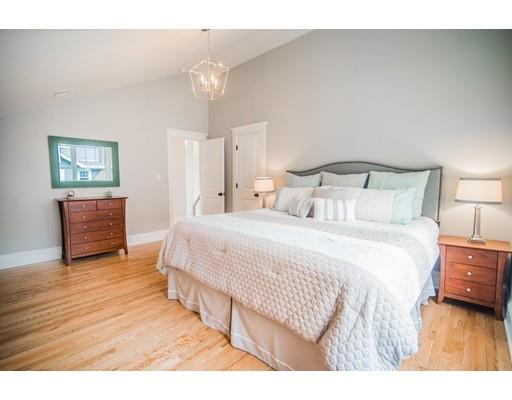 25 Lawton Road Needham, MA 02492 - Photo 21 of 34 a bedroom with a bed and a night stand