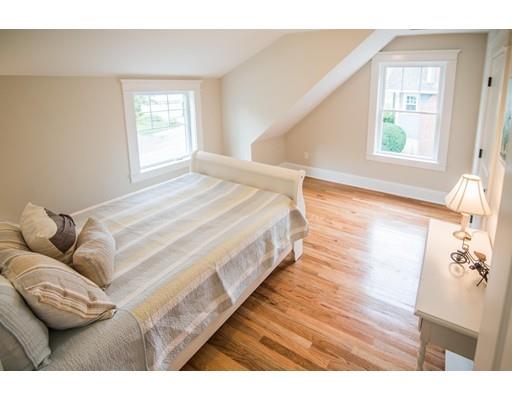 25 Lawton Road Needham, MA 02492 - Photo 25 of 34 a bed sitting in a bedroom next to a window