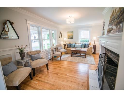 25 Lawton Road Needham, MA 02492 - Photo 4 of 34 a living room with furniture a fireplace and a large window
