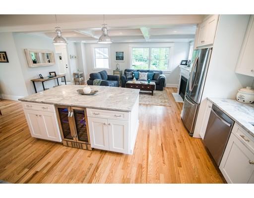 25 Lawton Road Needham, MA 02492 - Photo 9 of 34 a open kitchen with cabinets a sink a window and stainless steel appliances