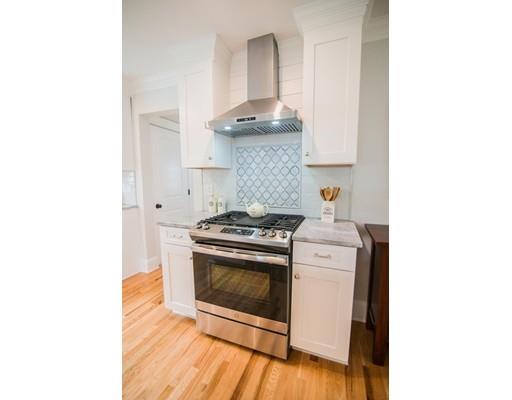 25 Lawton Road Needham, MA 02492 - Photo 10 of 34 a white stove top oven sitting inside of a kitchen