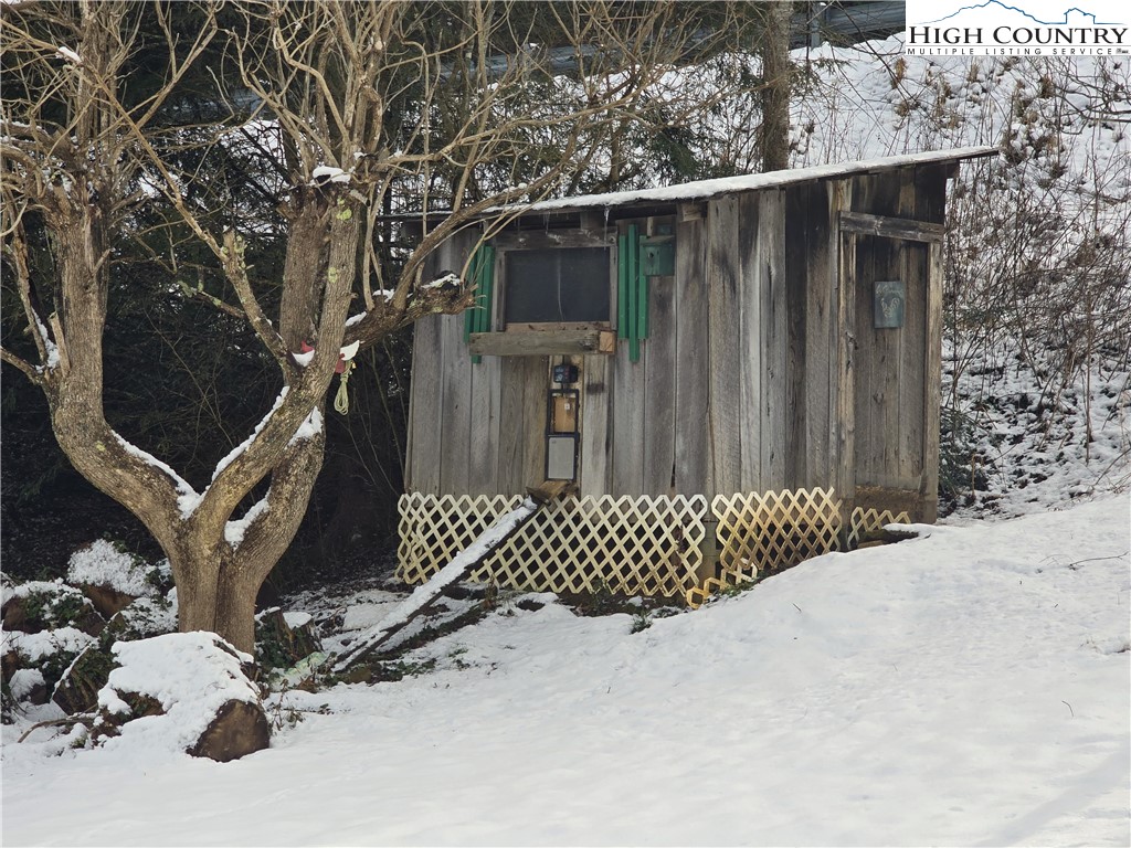 325 Sawyers Road Warrensville, NC 28693 - Photo 17 of 39 a view of a house with a wooden fence
