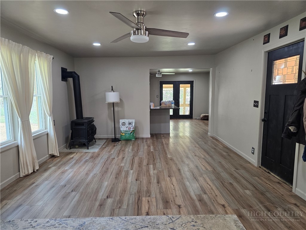 325 Sawyers Road Warrensville, NC 28693 - Photo 26 of 39 a view of livingroom with hardwood floor and a ceiling fan