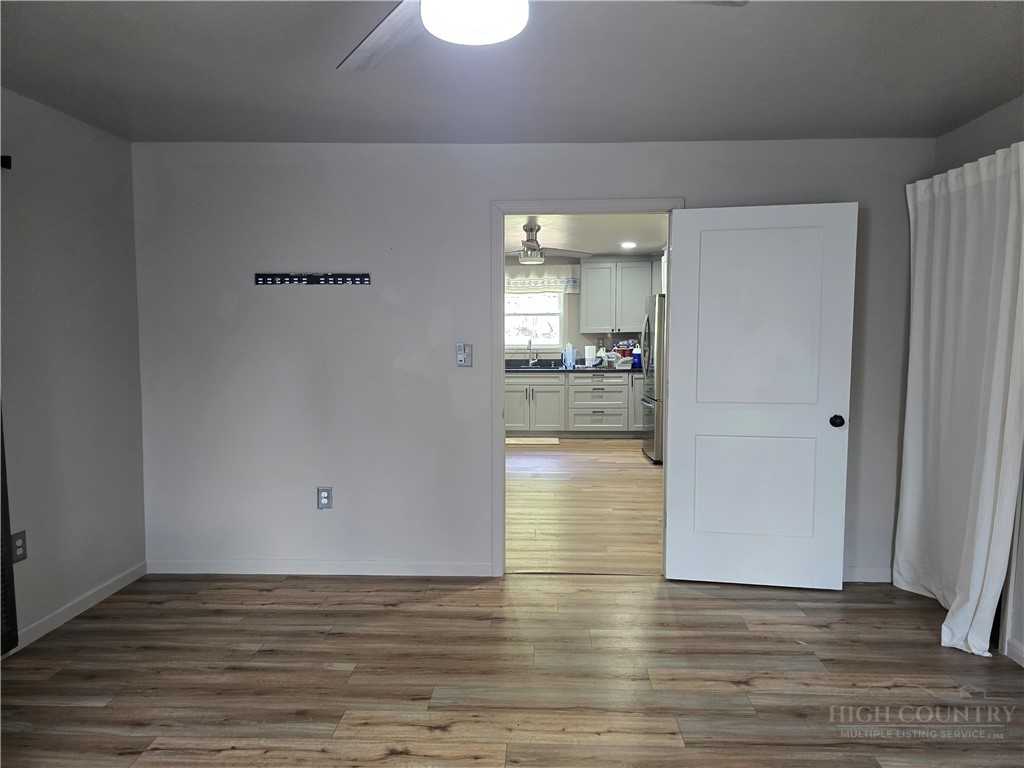 325 Sawyers Road Warrensville, NC 28693 - Photo 29 of 39 a view of a kitchen with wooden floor