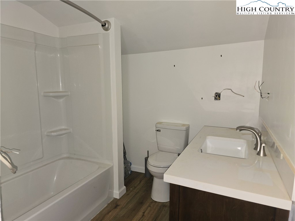 325 Sawyers Road Warrensville, NC 28693 - Photo 32 of 39 a bathroom with a sink and a bathtub