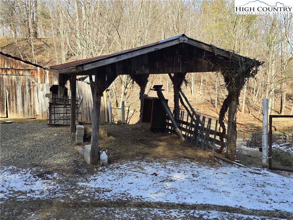 325 Sawyers Road Warrensville, NC 28693 - Photo 35 of 39 a view of a wooden house with a large trees