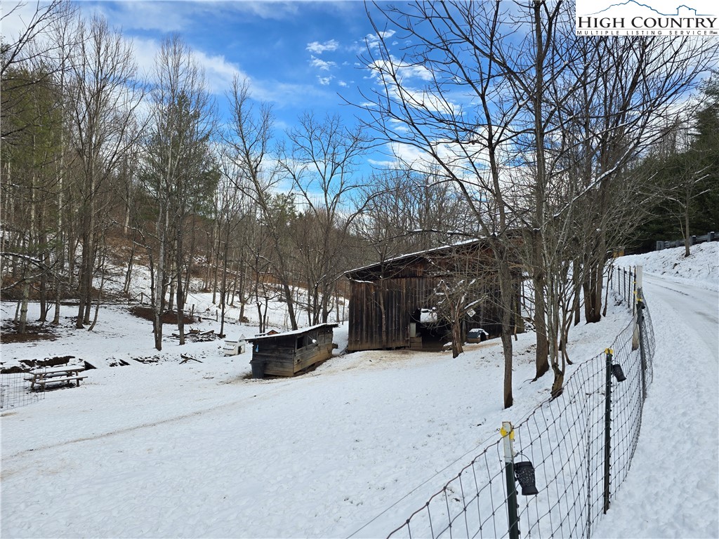 325 Sawyers Road Warrensville, NC 28693 - Photo 8 of 39 a view of outdoor space covered with snow