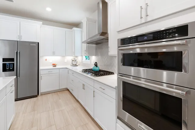 a bedroom with a bed and flat screen tv